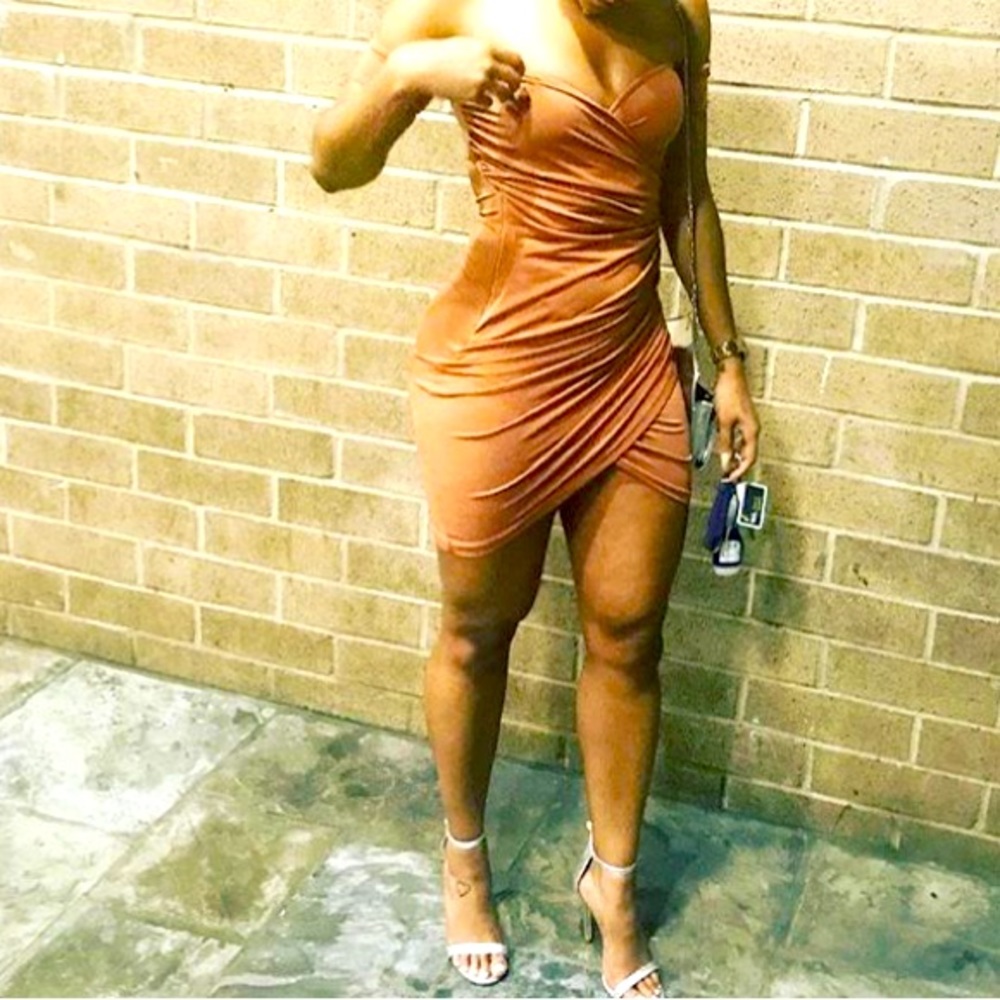 Body hugging, brownish tan dress.